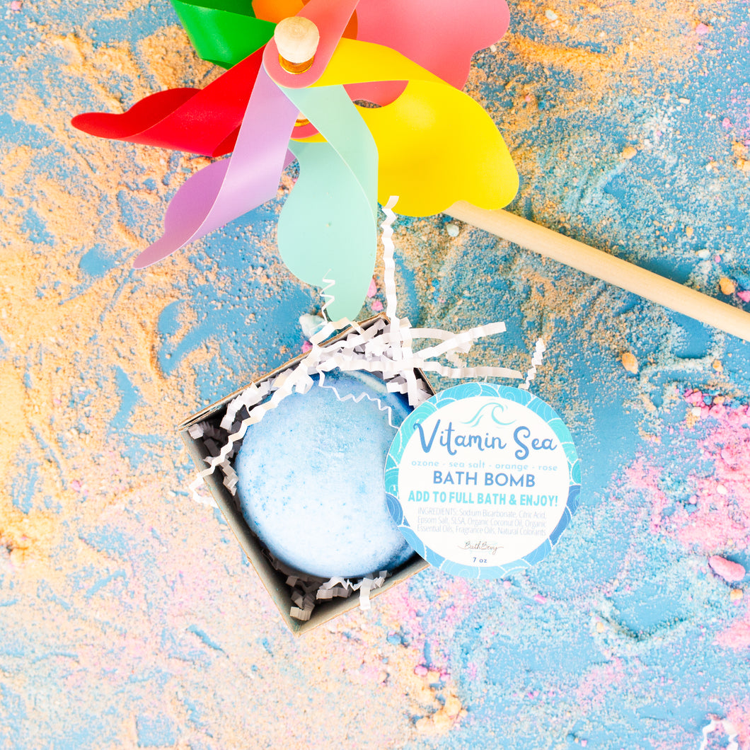 Bath bomb with a colorful windmill toy on a textured surface