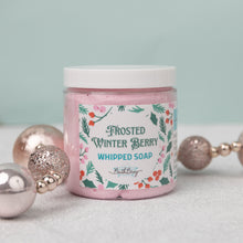 Load image into Gallery viewer, A jar of Frosted Winter Berry Whipped Soap by Bath Bevy, decorated with holiday ornaments on a light background.