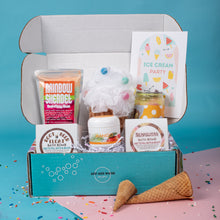 Load image into Gallery viewer, Box of bath products with a cone and sprinkles on a blue and pink background