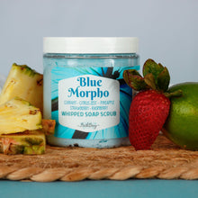 Load image into Gallery viewer, Jar of Blue Morpho whipped soap scrub with pineapple, strawberry, and lime on a woven mat.